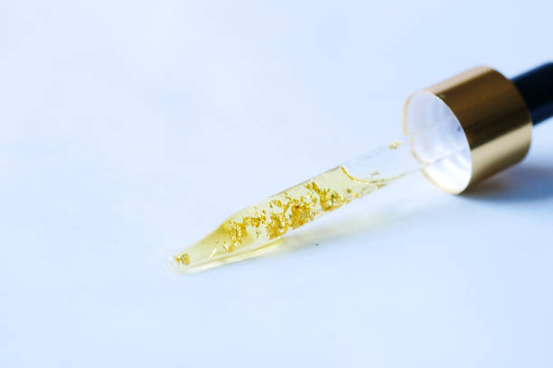 istock Drop falls from a pipette into a cosmetic bottle 1364420814