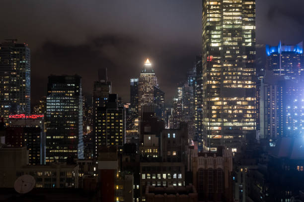 Manhattan interior view from a high floor at night in NYC stock photo
