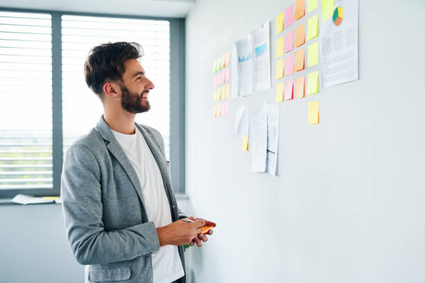istock Young businessman working in office planning new business strategy 1364422158