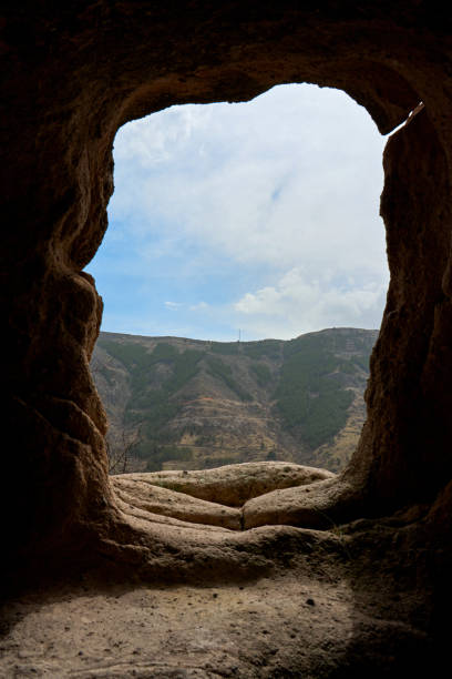 istock View from the dwelling in the cave. A passage carved in stone 1364422185