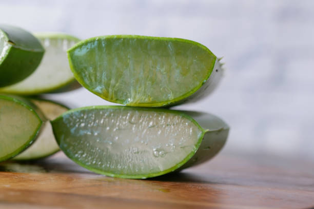 istock Close-up Fresh Aloe vera sliced on a chopping board 1364423691