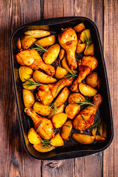 istock Roasted chicken legs with potatoes and rosemary. 1364424202