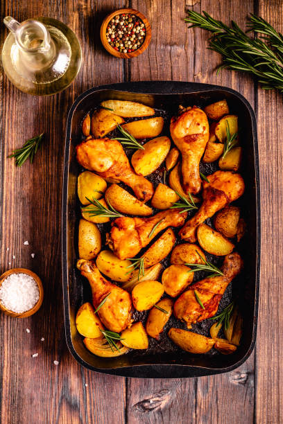 istock Roasted chicken legs with potatoes and rosemary. 1364424203