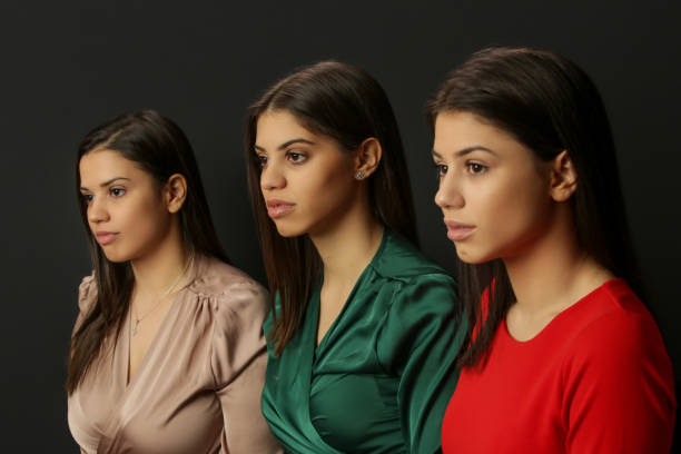 istock Three beautiful Caucasian women, side view, studio shot 1364425474