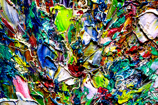 Abstract multicolored background made with acrylic paints. Colored volumetric strokes in a chaotic manner. Blurred image.