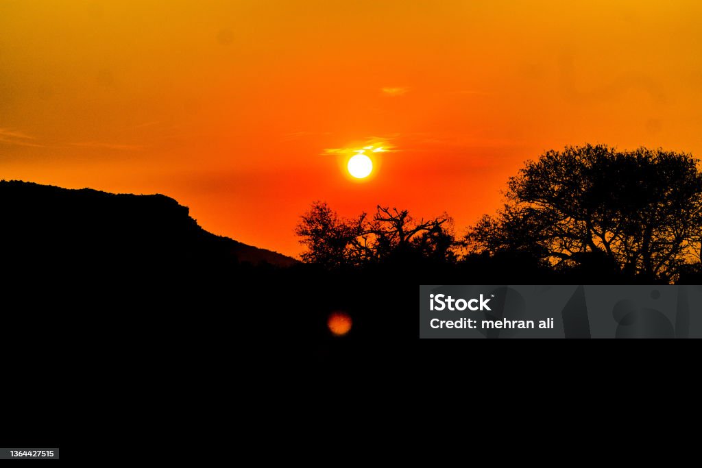 sunset in the mountains A sunset in the Kp province of Pakistan Beauty In Nature Stock Photo