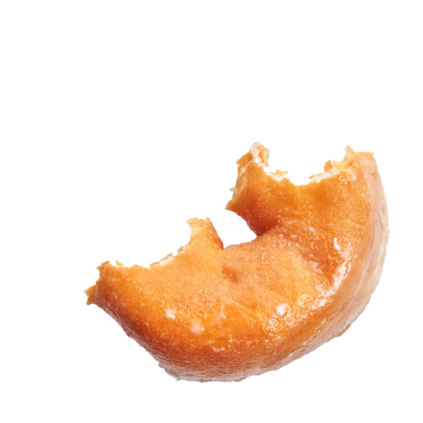 istock Piece of glazed doughnut isolated over white background 1364428909