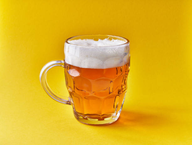 istock One jar of beer over yellow background 1364429661