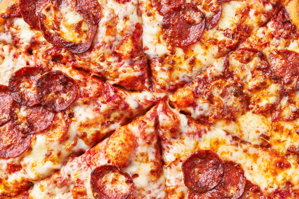 istock Delicious pepperoni italian pizza texture 1364430311