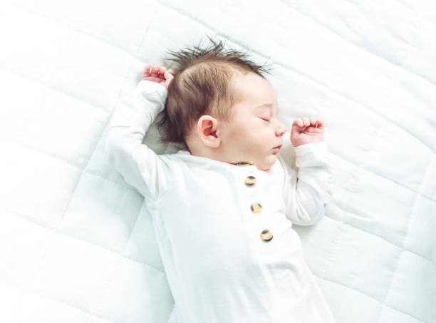 istock Cute gender neutral newborn baby sleeping 1364431757