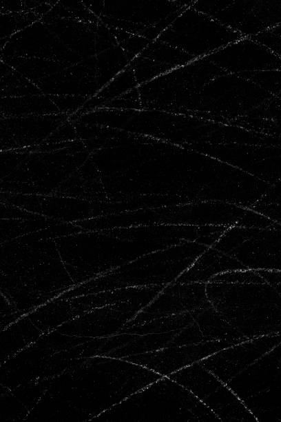 istock White dust particles and scratch lines on a black concrete wall surface for background 1364437085