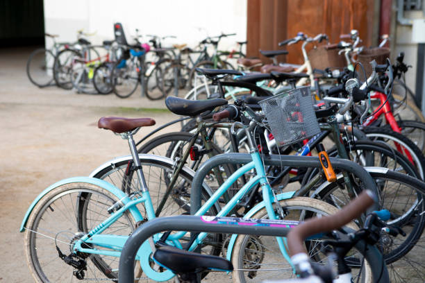 istock Several bicycles in a row, chained up outside a railway station 1364439281
