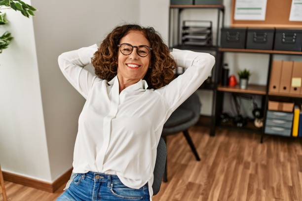 istock Middle age hispanic woman smiling confident relaxing at office 1364443042