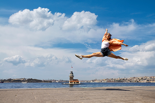 Beautiful dancer dancing front of maiden's tower view in Istanbul city