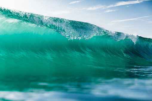Ideal surfing wave in Atlantic ocean. Glassy turquoise wave