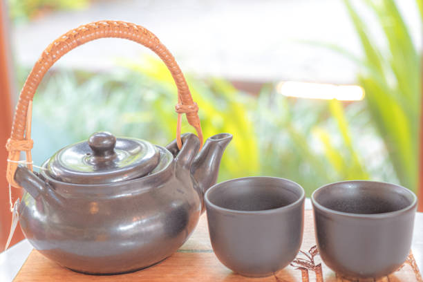 istock hand pour Chinese or Japanese traditional tea 1364447147