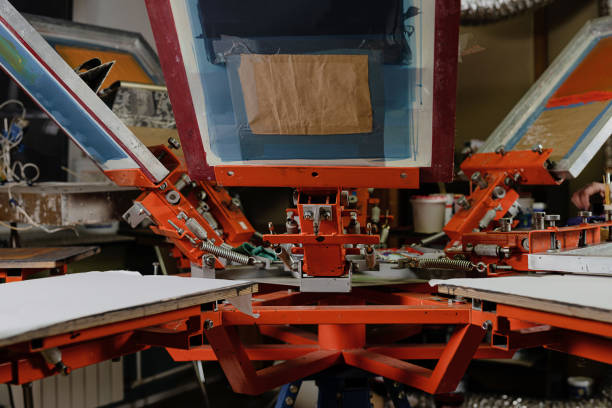 istock print screening apparatus. serigraph printing production. silk screen textile printery 1364447891