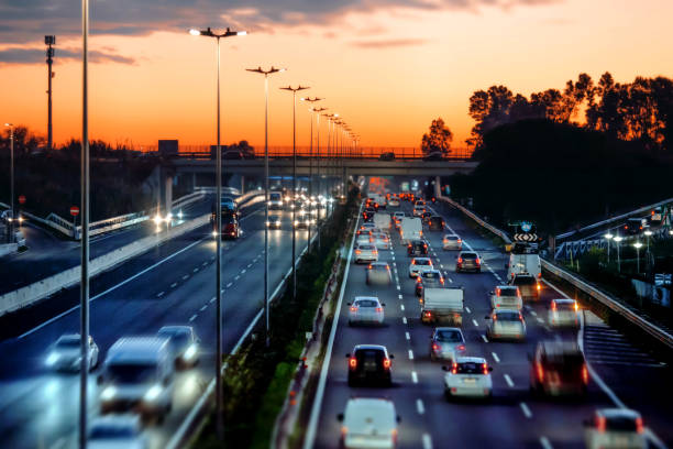 Busy highway with cars lined up at sunset