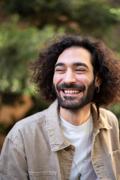 istock Gleeful Hispanic man looking away with smile 1364450680