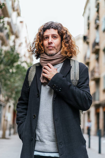 istock Confident mature male adjusting scarf 1364451530
