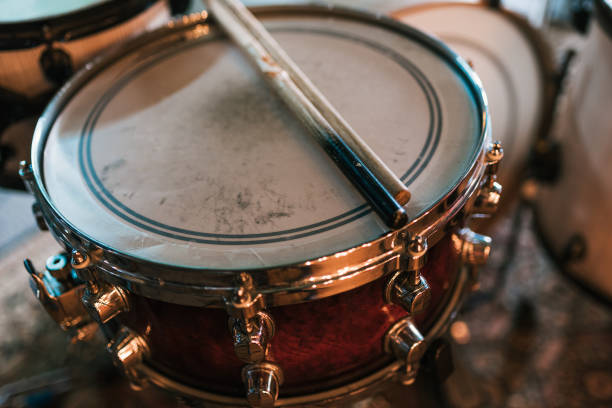 istock Wooden drumsticks on drum on stage in club 1364453304
