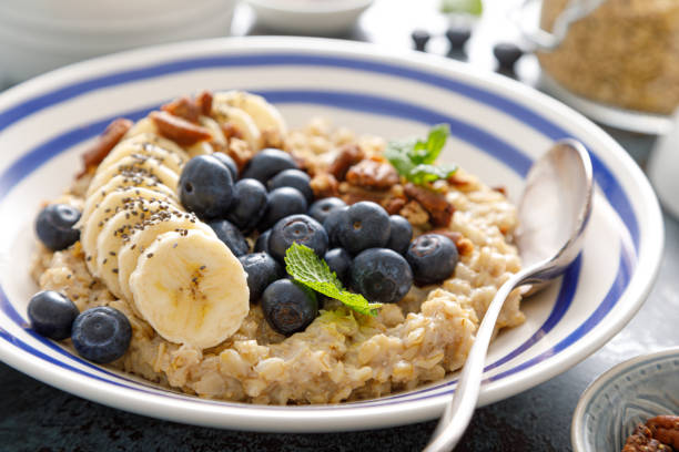 istock Oatmeal with fresh blueberries and pecans and banana 1364453545
