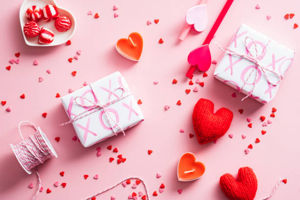 istock Happy Valentines Day concept. Flat lay composition with gift boxes, red hearts, ribbon, sweets on pink table. 1364455080