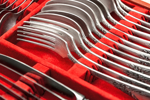 Silver cutlery in a red velvet case