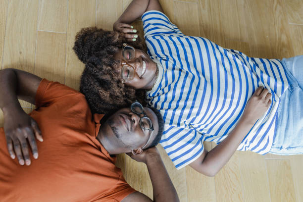 istock Young couple lying on the floor 1364457077