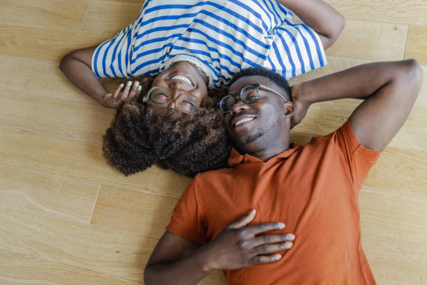 istock Young couple lying on the floor 1364457198