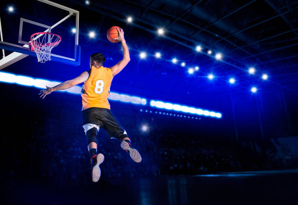 Basketball player players in action. Basketball concept on dark background