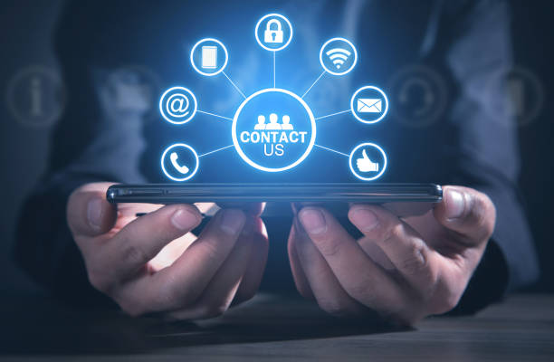 istock Contact us concept with a man holding smartphone. Customer support 1364461611