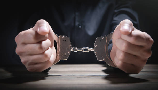 istock Caucasian man in handcuffs. Arrest 1364461622
