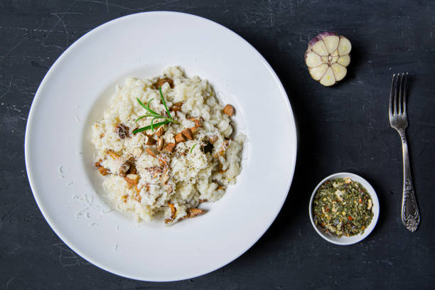 istock Tasty creamy risotto with mushrooms and almonds. 1364461646