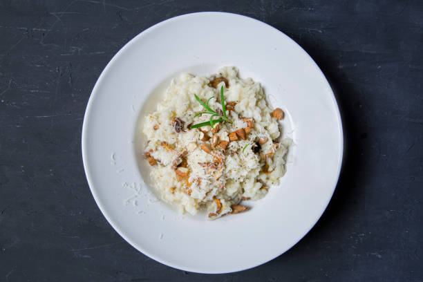 istock Tasty creamy risotto with mushrooms and almonds. 1364461651