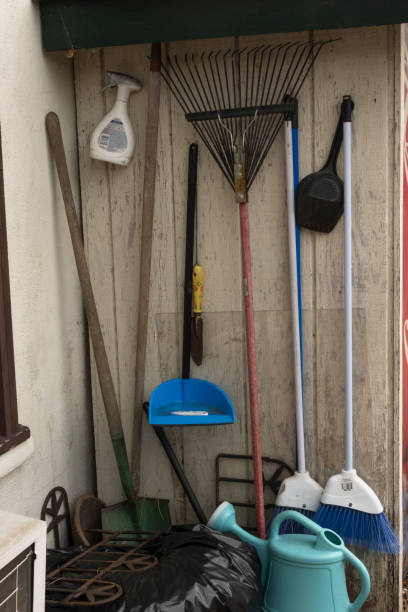 istock Cleaning and gardening objects hanging outside store 1364461741