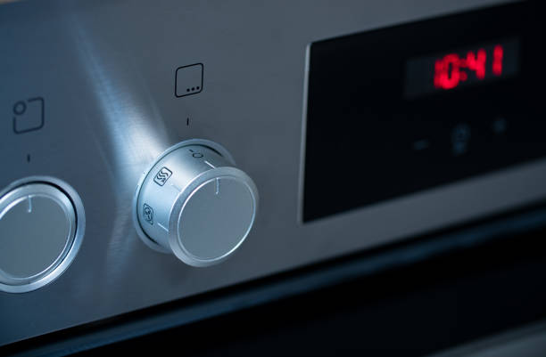 istock Kitchen oven, close-up rotary switch to choose a program for the baking oven. 1364467255