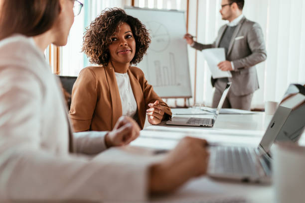 istock Young business people discussing at the meeting 1364469963
