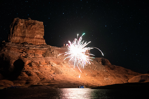Giant fireworks being fired over Lake Powell, Utah