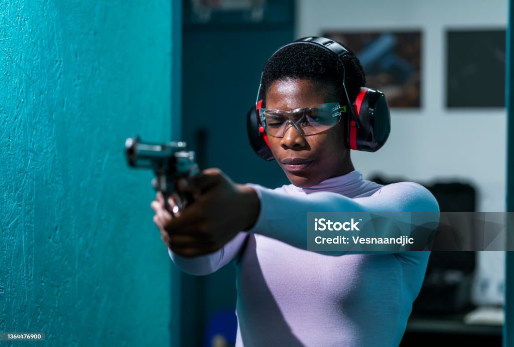 Shooting range Woman at shooting range Gun Stock Photo