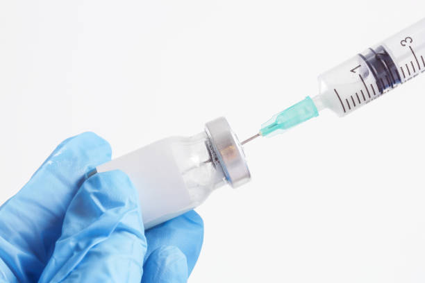 istock Scientist or medical worker holds vaccine bottle.Vaccination, immunization, treatment to provides active acquired immunity to a particular infectious disease. Healthcare And Medical concept. 1364481904