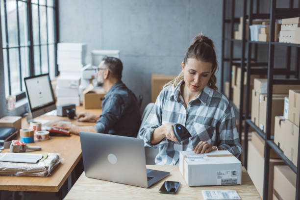 Small business owners Two business partners working together at warehouse for online seller business. ordering stock pictures, royalty-free photos & images