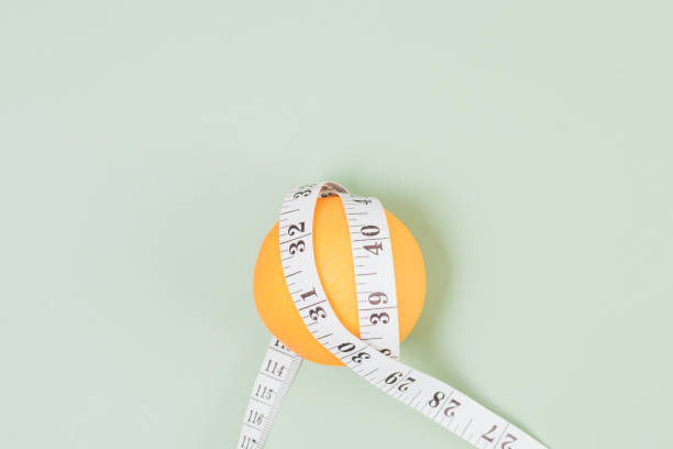 istock Slimming and anti-cellulite concept with fresh orange 1364482603