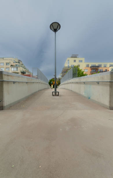 istock A woman and her son on a concrete walkway. 1364483523