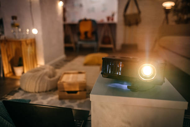 Living room with projector with light on for a show stock photo
