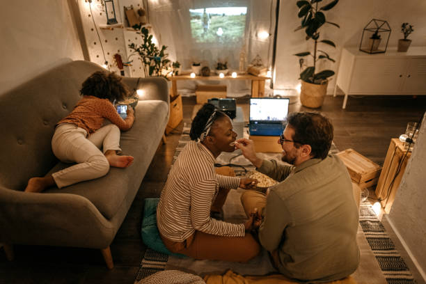 istock Man feeding popcorn to woman 1364485960