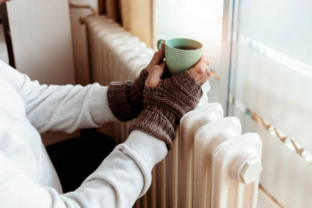 warming up with hot tea always gives great results. - glove winter wool touching imagens e fotografias de stock