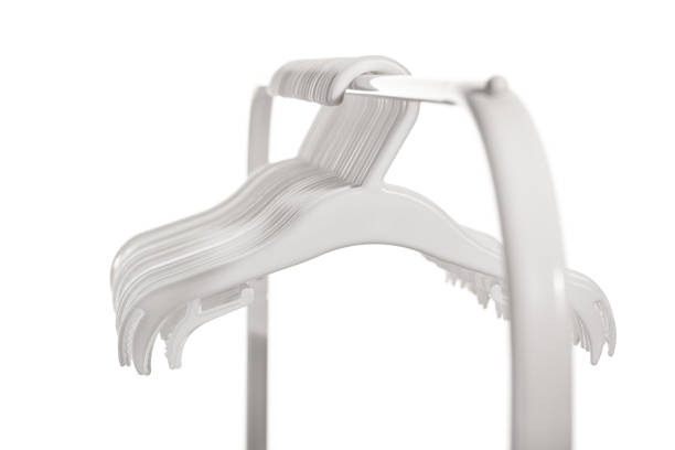 istock White plastic hangers for clothes hanging on rod from clothing rack. Isolated on white background.. 1364490214