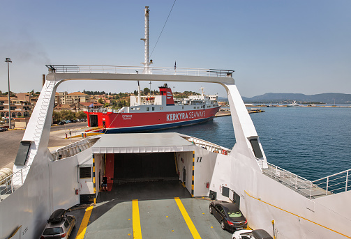 Kerkyra, Corfu, Greece - August 10, 2021: Ano Hora II ferry ship open hold intended for loading vehicles, ready for loading in passenger port of Corfu. The ship was built in 2004.