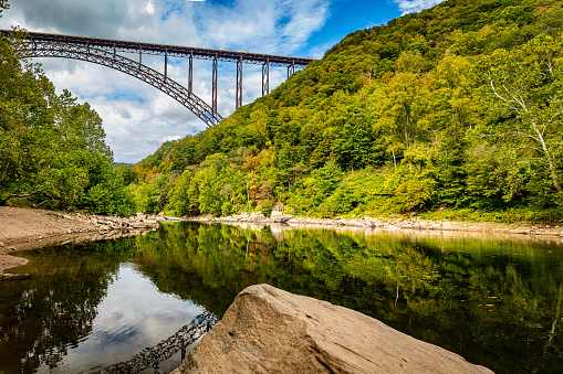 The New River Gorge Bridge at New River Gorge National Park and Preserve during the Autumn leaf color change near Fayetteville, West Virginia.